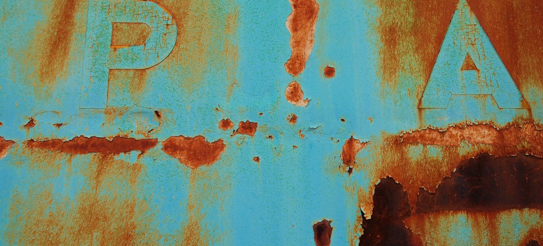 turquoise train car with rust